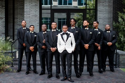 This wedding party photo deserves to be on the cover of Vogue. The groom wore a white blazer with black lapels. To create some contrast the groomsmen wore all-black suits with white bowties for their The Cordelle Wedding in Nashville, TN | John Myers Photography & Videography Black Groomsmen Suits, Black Groomsmen, The Cordelle, Groom Suit Black, John Myers, Groomsmen Poses, Groomsmen Style, Side Photo, Nashville Wedding Venues