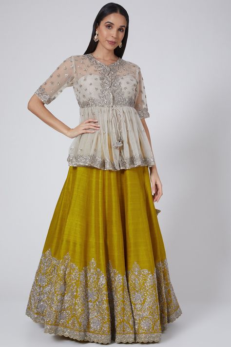 Featuring a mustard lehenga in raw silk base with zardosi embroidery. It is paired with a contrasting peplum top in net base and a bustier.  FIT: Fitted at bust and waist. COMPOSITION: Raw silk, Net. CARE: Dry clean only. Peplum Top Outfits Indian With Skirt, Peplum Top Outfits Indian, Maternity Party Wear, Peplum Top With Skirt, Indian Skirt And Top, Skirt And Top Indian, Mustard Lehenga, Skirt And Top Outfits, Peplum Top Outfits