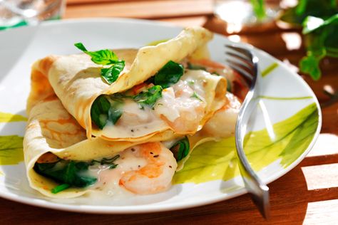 Crêpes with Shrimp, Spinach and Herb Filling | Recipe by: Ellie Krieger MS RD | These scrumptious, savory crêpes are easy to make and will bring an elegant flair to your special brunch menu. Using canola oil in the crêpe batter rather than butter and replacing some of the white flour with whole-grain flour makes the crêpes healthier without sacrificing their rich, decadent taste. Shrimp Spinach, Lobster Sauce, Crepes And Waffles, Savory Crepes, Crepe Recipes, Seafood Dishes, Fish And Seafood, Burritos, Enchiladas