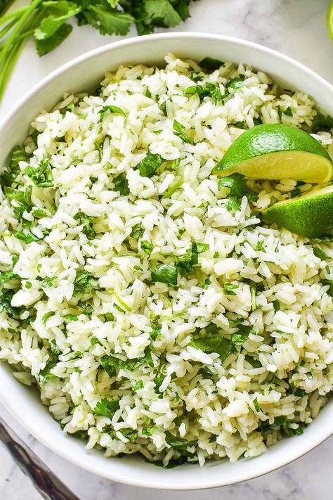 The BEST Cilantro Lime Rice - made with just 5 ingredients and ready in 30 minutes or less. A bright, fresh side dish that instantly elevates any meal! Cilantro Lime Minute Rice, Mexican Cilantro Lime Rice, Lime And Cilantro Rice, Lime Rice Cilantro, Rice Recipes For Dinner Side Dishes, Rice With Cilantro And Lime, Rice Cilantro Lime, Chipotle Lime Rice, Lime Cilantro Rice