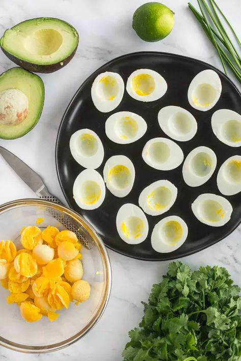 · Print Recipe These deviled eggs with avocado are a fun, delicious, mayonnaise-free twist on the more traditional recipes. This healthy appetizer is keto, gluten-free, dairy-free, paleo and Whole30, so they’re sure to be a hit in any crowd! Using just 7 ingredients, these deviled eggs with avocado can be thrown together in 20 minutes, making them ideal for last minute entertaining. To make these deviled eggs vegetarian, simply omit the bacon from the recipe. How to… Deviled Eggs With Avocado, Traditional Potato Salad Recipe, Eggs With Avocado, Avocado Keto, Baked Spinach Artichoke Dip, Super Healthy Snacks, Avocado Deviled Eggs, Healthy Appetizer, Prosciutto Wrapped Asparagus