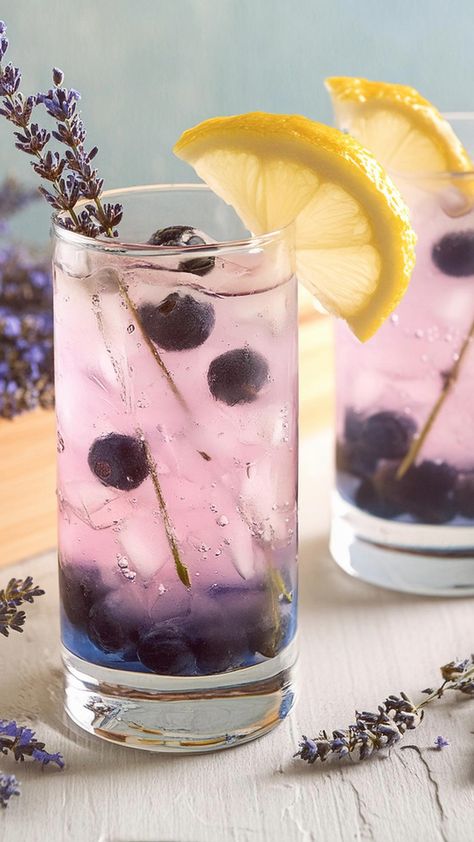 We’re taking a cocktail classic to the next level with this Blueberry Tom Collins. It’s the same Tom Collins you know and love, but bluetified with a quick Lavender Blueberry Cocktail, Blueberry Lavender Syrup, Lavender Gin And Tonic, Uses For Lavender Syrup, Botanical Drinks, Lavender Soda, Lavender Drinks, Lavender Collins, Drink Flavors