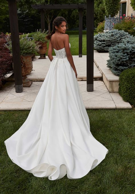 Our Patricia wedding dress is an elegant A-line with classic details. The strapless sweetheart bodice features embroidery with boning for added structure and support. The sleek, pleated satin skirt floats off the body in an A-line silhouette. We love the fun addition of pockets to the gown. Available at the Atlas Bridal Shop. Atlas Bridal Shop is a bridal shop in Toledo, Ohio. Designers include Morilee, Allure Bridal, Allure Couture, Maggie Sottero, Rebecca Ingram, Sottero Midgely and more. Allure Bridal Couture, A Line Wedding Dress Sweetheart, Pleated Satin Skirt, Sweetheart Corset, Allure Couture, Bridal Studio, Corset Bodice, Classic Wedding Dress, Allure Bridal