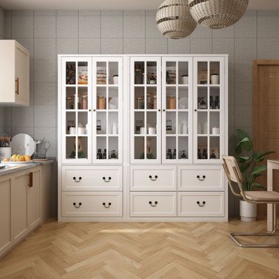 This kitchen pantry has a variety of storage spaces that can perfectly meet your needs. Versatile storage for microwaves, toasters and other appliances. 5 Transparent tempered glass doors combined with unique appearance and metal hinges will provide better user experience. It also has six drawers that open silently below it, providing ample space for storing kitchen items. The sturdy base provides strong support and good stability. Exquisite craftsmanship and modern style, buffet sideboard is su Cabinet For Kitchen, Dining Cabinet, Cabinet Wood, Buffet Sideboard, Tempered Glass Door, Metal Hinges, Nursery Furniture Sets, Cabinets For Sale, Kitchen Pantry