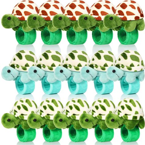 PRICES MAY VARY. Sufficient Quantity: you will receive 15 pieces stuffed turtle slap bracelet party favors in 3 different styles, 5 pieces for each color, which are exquisite and adorable, can easily get people's attention; You can wear them, share with others, or keep them as special bracelet collections Proper Size: the stuffed turtle animal slap bracelets measure about 8.66 inches/ 22 cm, fit comfortably on most wrists without slipping off, making them ideal accessories for most people who lo Turtle Slap, Turtle Birthday Theme, Turtle Baby Shower Theme, Turtle Decorations, Lizard Party, Sea Party Favors, Turtle Birthday Party, Stuffed Turtle, Goodie Bag Stuffers