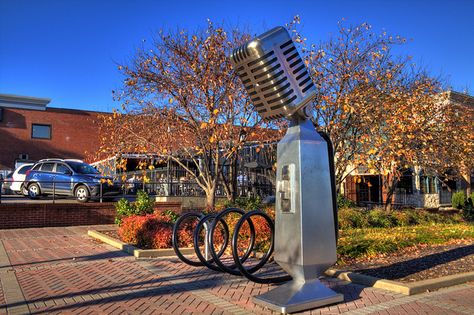 Music Row Microphone  Microphone street sculpture at the end of the street leading in "Music Row" in Nashville, Tennessee  This is the "Microphone Rack" the work of Franne Lee, Keith Harmon and Mac Hill located at the northeast corner of Demonbruen Street and Music Row. It was designed to be used as a bike rack. Music Row Nashville, Street Sculpture, Visit Nashville, Music Row, Music City Nashville, Tennessee Travel, Nashville Trip, Roadside Attractions, Bike Rack