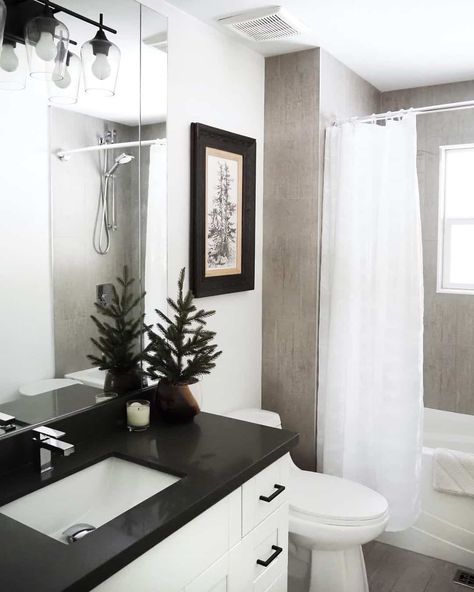 Black Countertop Bathroom Decor, White Vanity Black Countertop, Black Countertops Bathroom, Black Bathroom Countertops, Gray Bathtub, Black Sink Faucet, Stained Wood Cabinets, White Subway Tile Shower, White Cabinets White Countertops