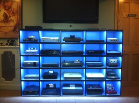 This is awesome pretty good idea to buy the neon lights and build the cabinet #gaming Tv Stand For Gaming Consoles, Gaming Shelf, Video Game Room Ideas, Man Cave Shed, Retro Games Room, Ideas Cuarto, Gaming Room Ideas, Gaming Rooms, Video Game Collection