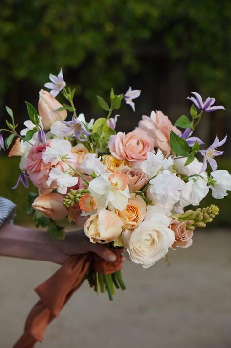 Lavender And Peach Wedding Bouquet, Lilac Spring Wedding, Peach And Purple Wedding Flowers, Purple And Peach Bouquet, Peach And Lavender Bouquet, Lavender And Peach Wedding Decor, Peach Flower Bouquets, Daffodil Wedding Bouquet, Daffodil Bouquet Wedding