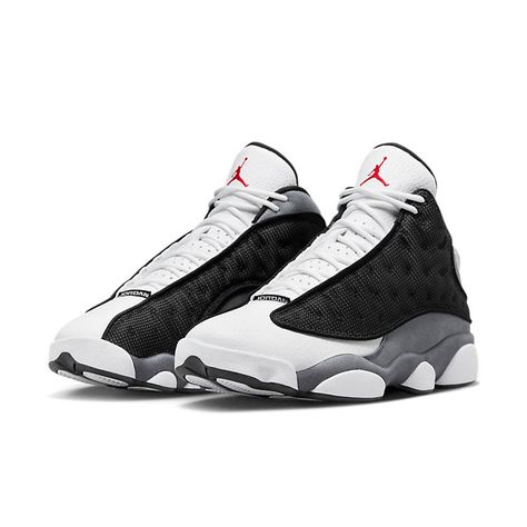 The Air Jordan 13 Retro 'Black Flint' is a sleek and stylish sneaker with a minimalist color palette. The Jordan branding on the upper is detailed and adds to the shoe's charm. The toe is designed to protect against scuffs and collisions, making it perfect for any activity. Inspired by the iconic Black Cat, this sneaker is part of a series of shoes that are sure to turn heads. The combination of black, university red, flint grey and white make this shoe a timeless classic. Whether you're on the Jordan Retro 13 Black, Zapatillas Jordan Retro, Air Jordan Retro 13, Jordan 13 Black, Jaket Denim, Mid Top Shoes, Retro 13, Retro Basketball Shoes, Nike Snkrs