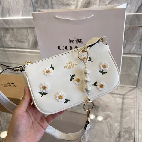 Coach sling bag ||COACH NOLITA DAISY APPLIQUE BAG Shoe Locker, Tas Coach, Coach Sling Bag, Coach Sling, Coach Nolita, Aesthetic Bags, Luxury Bags Collection, Shirt Outfits, Cute Handbags