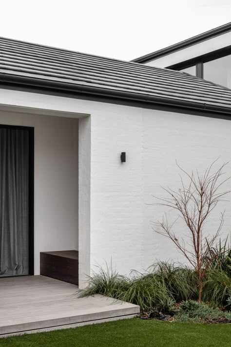 This large family residence is composed of two masonry and tiled gable roof structures, a contemporary but contextual response to the more traditional homes in the leafy hillside street. #melbourne #home #modern #contemporary #builder Modern Brick House Exterior, White Brick House Exterior, Painted Brick Exteriors, White Exterior Houses, Melbourne Home, Exterior Tiles, House Cladding, Dark House, Traditional Homes