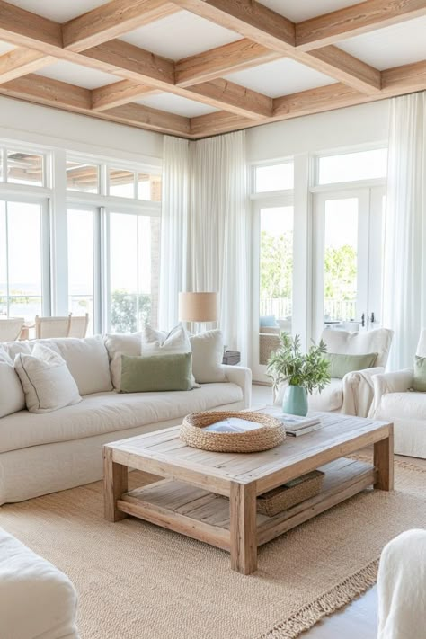 Create a cozy, warm space with these tips for a coastal living room. Coastal Formal Living Room, Modern Organic Coastal Living Room, Neutral Costal Interior Design, French Coastal Living Room, Beach Aesthetic Living Rooms, Soft Contemporary Home Interiors, Calm Coastal Living Room, Scandinavian Interior With Color, Coastal Sunroom Ideas