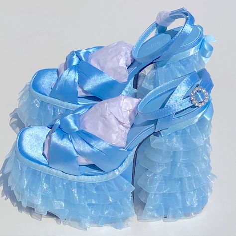 Sugar Thrillz Platform Layered Lace Satin Crystal Blue Sandals Heels Size 9 Feature A Satin Construction, A Ruffled Tulle Trim On The Platform Soles And Block Heels, A Bow Trim In The Back, Knotted Foot Uppers, And Rhinestone Buckle Closures. Details: Light Blue Man Made Materials 6" Heel 3" Platform Sugar Thrillz Shoes, Diy Heels, Blue Sandals Heels, Pink Slides, Dr Shoes, Funky Shoes, Sugar Thrillz, Girly Shoes, Blue Heels