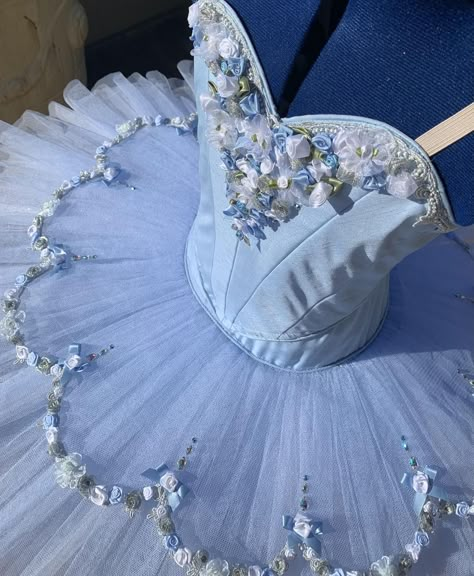 Beautiful blue flower tutu, traditional piped sweetheart bodice. Fully lined with blue and white ribbon roses, bows embellishing the bodice and metallic silver trim. The Tutu skirt has 9 full layers of alternating blue and white nets, with crystal tulle trim to give an extra depth of color with a flower overlay with more ribbon roses and crystals. Hook and eye closure. Custom Made. Delivery time: 5 to 7 weeks $1000 AUD plus postage Tutu Skirt Ballet, Blue Ballet Costume, Blue Ballet Dress, Ballet Pattern, Flower Overlay, Ballet Costumes Tutus, Preppy Chic Outfits, Pancake Tutu, Skirt Tutu