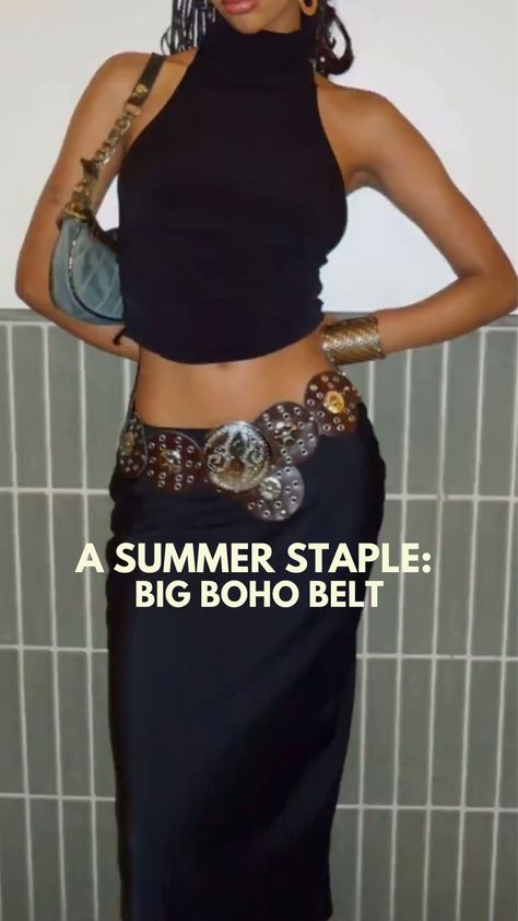 A black high neck tank is paired with a long maxi skirt and a jean shoulder bag. A big circular belt is laying flat around the waist of the skirt, give the outfit a boho look. Boho Chic Accessories Jewelry, Disk Belt Outfit, Boho Belt Outfit, Circle Belt Outfit, Big Belt Outfit, Wide Belt Outfit, Western Belt Outfit, Western Belts Outfit, Belted Skirt Outfits