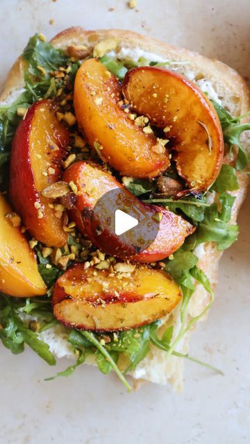 Gal Shua-Haim MS, RD on Instagram: "grilled halloumi peach sandwich 🍑

a sweet & savory sandwich made with toasted ciabatta, broiled honey peaches, grilled halloumi, creamy ricotta, arugula, pistachios and hot honey

comment “recipe please” and ill send the full recipe straight to you! 

https://somethingnutritiousblog.com/peach-halloumi-sandwich/" Halloumi Toast, Peach Sandwich, Peaches Grilled, Halloumi Sandwich, Grilled Halloumi, Lunch Inspiration, Hot Honey, Haim, Trader Joe’s