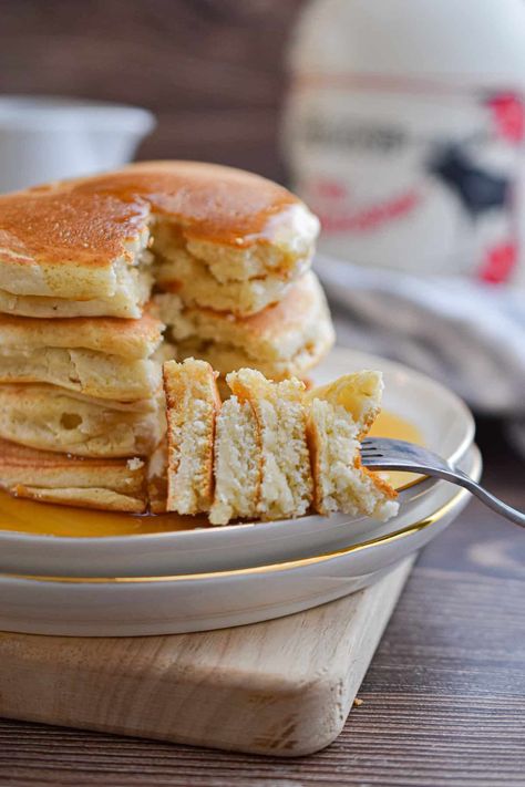 A fork is holding a piece of the stack of Bisquick pancakes no eggs. Overnight Pancakes, Buttermilk Pancake Recipe, Bisquick Pancakes, Sour Cream Pancakes, Buttermilk Pancake, Pancake Recipe Buttermilk, Perfect Pancakes, Tasty Pancakes, Buttermilk Pancakes