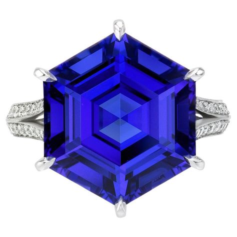 Remarkable one-of-a-kind 10.21 carat Tanzanite Hexagon platinum ring, decorated with a total of 0.61 carat round brilliant collection diamonds. Tanzanite dimensions: 15.2 x 12.9 x 8.4 mm. Ring size 6.5. Resizing is complementary upon request. Crafted by extremely skilled hands in the USA. Returns are accepted and paid by us within 7 days of delivery. Please FOLLOW the MERKABA storefront to be the first to view the latest of our ultra exclusive jewels and supreme gemstones. Merkaba Jewelry, is a unique, world-class jewelry brand, dedicated to unveiling the rarest, finest and most sought-after gemstones globally, such as Alexandrite, Paraiba Tourmaline, "no oil" Emeralds, unheated Sapphires and Rubies, Padparadscha Sapphire, Aquamarine, Tsavorite, Spinel, Mandarin Garnet, Chrome Tourmaline, Class Jewelry, Mandarin Garnet, Chrome Tourmaline, Demantoid Garnet, Imperial Topaz, Padparadscha Sapphire, Paraiba Tourmaline, Tanzanite Ring, Star Sapphire