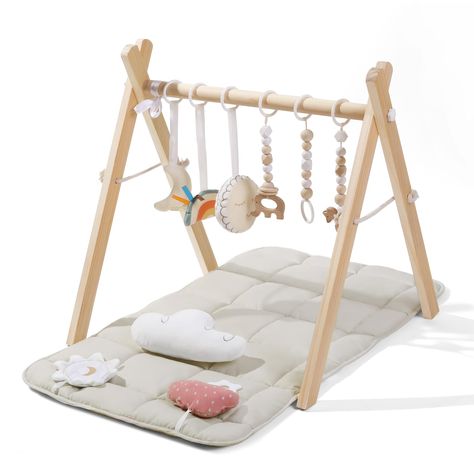 PRICES MAY VARY. SAFETY & STABILITY: With safety as our top priority, our wooden baby play gym is meticulously made from natural pine wood. Its smooth, burr-free surface and odorless composition ensure a safe baby play gym, validated by CPC testing. The sturdy triangle frame structure guarantees stability during your baby's playtime adventures COZY & SKIN-FRIENDLY MAT: Treat your little one to ultimate comfort with our soft, baby-safe play mat, measuring 35.6x17.1 inches. Crafted with care, the Wooden Play Gym, Triangle Frame, Registry Ideas, Baby Play Gym, Baby Room Neutral, Wood Clothes, Baby Stage, Activity Center, Baby Mat