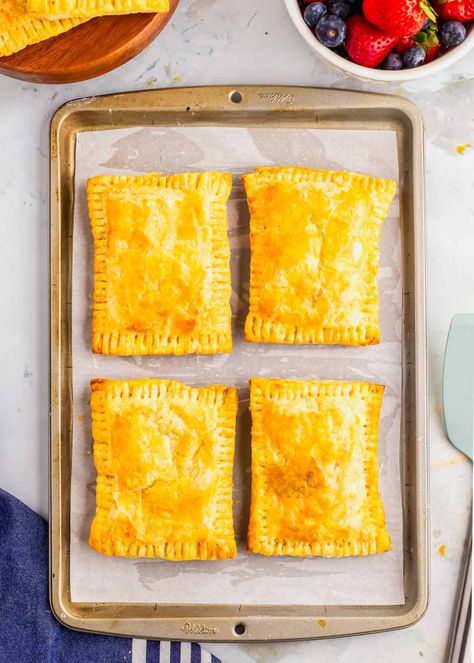 Craving a homemade twist on a classic favorite? Try this recipe for breakfast hot pockets! Filled with savory sausage, fluffy eggs, melted cheese, and colorful peppers, wrapped in golden puff pastry. Perfect for on-the-go mornings or a satisfying snack anytime. This recipe not only tastes better than the store-bought version but is healthier too, with no preservatives. Easily freezable, enjoy a delicious, convenient breakfast option whenever you need it. Make your mornings easier and tastier! Diy Breakfast Hot Pockets, Breakfast Pockets With Puff Pastry, Homemade Breakfast Hot Pockets, Puff Pastry Hot Pockets, Breakfast Puff Pastry Recipes Savory, Diy Hot Pockets, Hot Pockets Homemade, Breakfast Hot Pockets, Breakfast Puff Pastry