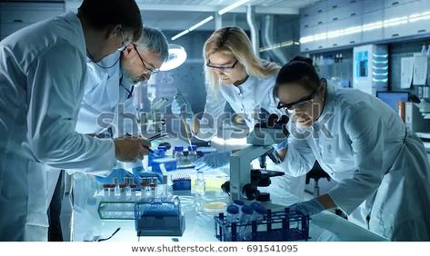 Team Medical Research Scientists Collectively Working | Royalty-Free Stock Image Research Scientist, Pharmaceutical Industry, Research Report, Clinical Research, Medical Research, Research And Development, Clinical Trials, Life Science, Market Research