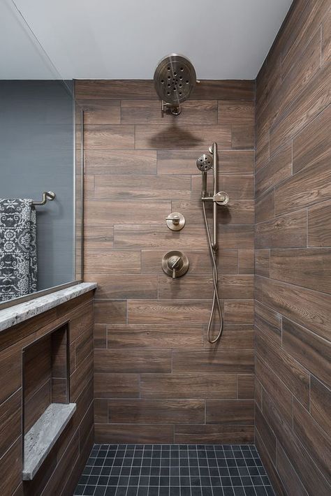 a stylish contemporary bathroom clad with wood look tiles and graphite grey ones, brass fixtures is a cool and bold idea with chic Wood Look Tile Bathroom, Wood Tile Shower, Rustic Bathroom Shower, Wood Tile Bathroom, Cabin Bathrooms, Rustic Bathroom Designs, Bathroom Redesign, Bathroom Remodel Designs, Rustic Bathrooms