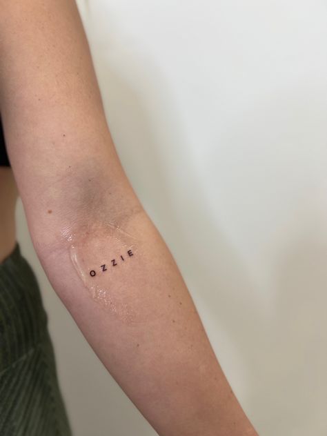 Small Tattoos Sons Name, Name Tattoos Dainty, Inner Elbow Name Tattoo, Guys Name Tattoo Ideas, Aesthetic Name Tattoos, Good Places To Put Name Tattoos, Capital Letter Tattoo, Name Tattoo Back Of Arm, Middle Name Tattoos