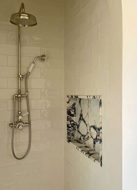 Shower wall ideas that are both practical and good-looking | Livingetc Bathroom Shower Shelves Built Ins, Single Glass Shower Panel, Marble Bathroom Niche, Shower Built In Storage, Marble Wall Tile Bathroom, Stone Shower Niche, Small Shower Niche Ideas, Shower Tile Ideas Walk In Master Modern, Wall To Wall Shower Niche