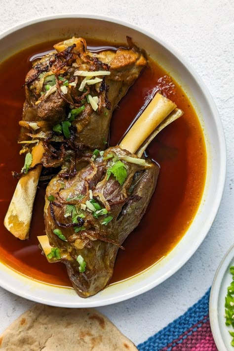 Nalli Nihari – Prepare homestyle Pakistani nalli nihari by simmering lamb shanks with homemade nihari masala and aromatics for a soothing comfort meal that’s perfect for special gatherings and cozy … The post Nalli Nihari appeared first on Jamil Ghar. Spicy Pakistani Food, Nalli Nihari, Lamb Shank Stew, Pakistani Food Recipes, Pakistani Foods, Nihari Recipe, Indian Comfort Food, Lamb Shank Recipe, Cozy Dinners