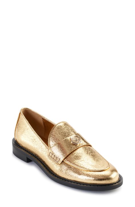 Elevate your everyday look with this prepster-classic loafer given eye-catching appeal by a shimmering golden finish. 1" heel Synthetic upper, lining and sole Imported Metallic Loafers, Loafer Women, Paris Woman, Sneaker Dress Shoes, Karl Lagerfeld Paris, Mary Jane Flats, Tommy Hilfiger Women, Sneaker Heels, Loafers For Women