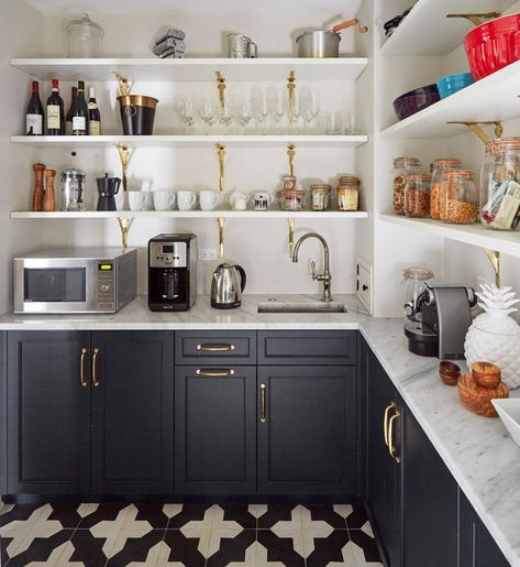 Butler's Pantry - The walk-in pantry is 56 square feet (about 5 square meters). Zaveloff used a graphic encaustic cement tile floor in here. The space holds small appliances, including a coffee station. Having a sink here makes morning drinks easier to prepare. Shaker cabinets painted in Inkwell and brass brackets tie the shelves to the kitchen design. Sleek Kitchen Design, Pantry Renovation, Organized Pantry, Pantry Remodel, Casa Country, Cabinet Remodel, Small Sink, Kitchen Pantry Design, Sleek Kitchen