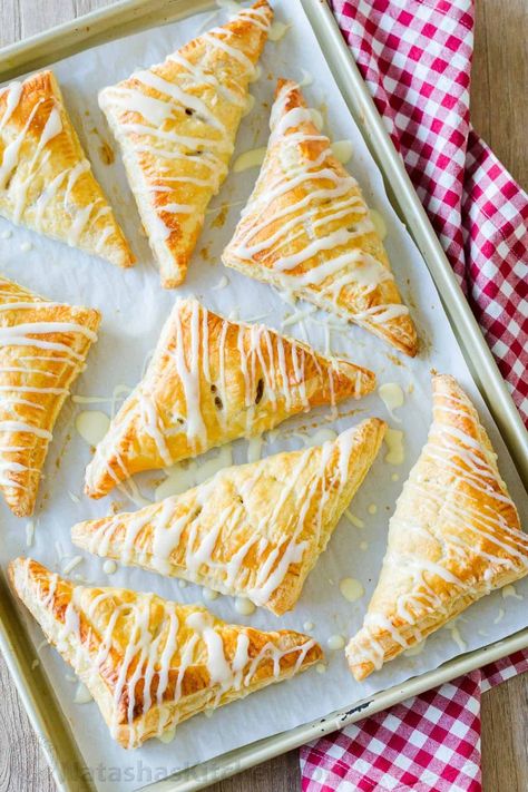 22 Apple Recipes that Are Full of Flavor Homemade Apple Turnovers, Apple Turnovers With Puff Pastry, Apple Cinnamon Roll Bake, Natasha Kitchen, Apple Turnover Recipe, Apple Turnover, Portable Dessert, Apple Slab Pie, Thanksgiving Side Dishes Easy