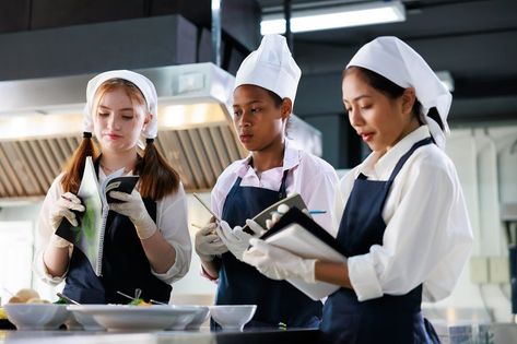 take note on book. Cooking class. culinary classroom. group of happy young woman multi-ethnic students are focusing on cooking lessons in a cooking school. Culinary Classroom, Cooking Contest, Girl Cooking, Cooking Lessons, Cooking School, Cooking Class, Cooking Together, Take Note, Space Design