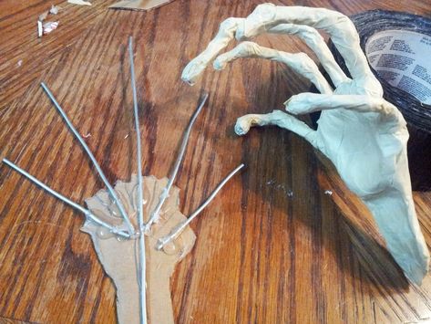 Diy Scary Halloween Hands, Halloween Shadow Figures, Paper Mache Hands Diy, Cardboard Halloween Props, Creepy Hands Halloween Diy, Diy Halloween Hands, Cardboard Crafts Halloween, Halloween Cardboard Crafts, Cardboard Halloween Decorations Diy