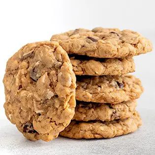 Hearty gluten free cowboy cookies, packed with coconut, gf oats, and chocolate chips, are just so much more satisfying than a regular cookie. You might even win a contest with them! Paradise Bakery, Cookie Recipes Oatmeal Raisin, Oatmeal Raisin Cookies Chewy, Camping Snacks, Cowboy Cookies, Oatmeal Raisin Cookies, Gf Desserts, Gluten Free Sweets, Raisin Cookies