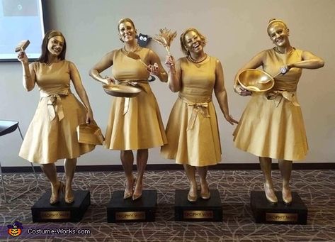 Trophy wife: Emily Steen, Nancy Folse, Christi Bergeron, and Monet Sasser from New Orleans, Lousiana, dressed as Trophy Wives. We found gold dresses, painted our bodies, made wooden boxes for us to stand on, spray painted them along with props, and had stickers made that said Trophy... Big Group Halloween Costumes, Costume Contest Winner, 2017 Halloween Costumes, Halloween Costumes To Make, Gold Dresses, Costume Works, Homemade Halloween Costumes, Homemade Costumes, Halloween Costume Contest