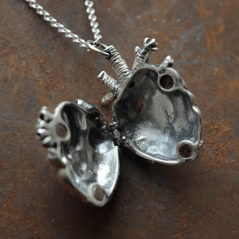 Please allow 10-15 days for production and delivery if item is not in stock.  Description:  This anatomical heart locket is just plain fun. A clever, tongue-in-cheek twist on the classic heart necklace, this is the perfect gift for the med student, nurse or cardiologist in your life.  After falling in love with a man in the medical industry, Justine was inspired to make an anatomical heart pendant. This is a very solid piece, which you could wear and love for a lifetime. This pendant is carved out of wax to look as close as possible to the real thing! This pendant is cast in jewellers bronze and has a thick silver plating.  Details:  Materials:  Pendant: Silver-Plated Bronze Chain: Sterling Silver Pendant Dimensions:  Length: 3cm Width: 2.25cm Chain Length: 20" Resin For Beginners, Anatomical Heart Pendant, Diy Resin Coasters, Student Nurse, Med Student, Anatomical Heart, Resin Coasters, Dope Jewelry, Diy Resin