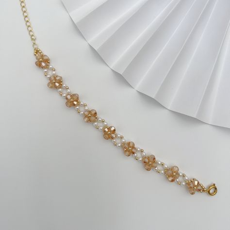 "Handmade item Delivery from a small business in Canada FEATURES Length: 4\" with 1.5\" extension chain (altogether 5.5\" - 6\"). Materials: 2mm 14K gold plated beads, 3mm natural shell beads, 4mm champagne rhombus Crystal beads Adjustable Made to Order ATTENTION Please note that these are handmade products. While I do my best to craft them, thread may be visible if look closely as it is a handmade product. Custom option available: - size: in inch - color: light blue, pink, black and green Please leave notes in order notes section! This custom-made bracelet is perfect for everyday wear.  It's also an ideal gift for your loved one, you can't go wrong with it and will be treasured for many years to come. SHIPPING We appreciate every order you place with us. Please keep in mind that we handcr Diy Jewelry Unique, Easy Diy Jewelry, Handmade Jewelry Tutorials, Bracelet Tutorial, Shell Beads, Jewelry Inspo, Handmade Products, Pretty Jewellery, Jewelry Tutorials