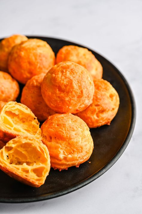 These Cheddar Gougères are essentially French cheese puffs made with choux pastry, and they're absolutely delicious! Crisp on the outside, light, puffed and airy on the inside and perfectly cheesy, these are a lovely appetizer to enjoy with wine or cocktails. French Cheese Puffs, Thanksgiving Recipe Ideas, Choux Dough, Christmas Side Dish Recipes, Roasted Carrots And Parsnips, Crab Stuffed Mushrooms, Sweet Bourbon, Caramelized Shallots, Outside Light