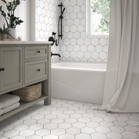 A hexagon with a farmhouse vibe, this on trend distressed porcelain tile will give your space that vintage look that fits every style or design. Elida Ceramica Edgefield White 6-in x 6-in Matte Porcelain Floor and Wall Tile (0.209-sq. ft/ Piece) | LW20121810 White Hexagon Tiles Bathroom, Bathroom Remodel With Hexagon Tile, Hexagon Tiled Shower Ideas, Small Bathroom Ideas Hexagon Tiles, Tile Inspo Bathroom, Hexagon Porcelain Tile Bathroom Floor, White Hexagon Shower Tile, White And Black Hexagon Tile Bathroom, White Octagon Tile Bathroom Floor