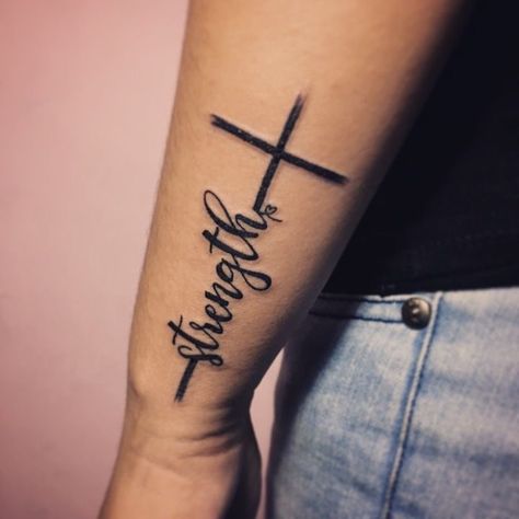 Womens Upper Leg Tattoo Ideas, Cross With Quote Tattoo, The Rest Is Still Unwritten Tattoo, Cross Forearm Tattoos For Women, Middle Of Back Tattoo For Women, Wrist Cross Tattoos For Women, Outside Forearm Tattoos For Women, Rare Tattoos For Women, Anexity Tattoo