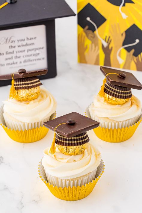 Graduation themed cupcakes with chocolate hats and gold foil wrappers with grad themed background Graduation Cupcakes Ideas 2024, Cupcakes For Graduation Party, Cupcake Graduation Ideas, Grad Cupcakes Ideas, Graduation Cupcakes 2024, Grad Party Cupcakes, Graduation Cupcake Ideas, High School Graduation Cupcakes, Cupcake Graduation