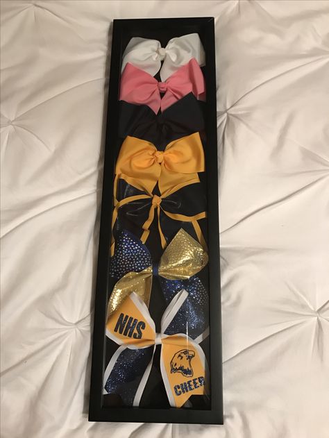 Display Cheer Bows, Cheer Bow Organizer, Cheer Bow Display Graduation, Cheer Uniform Display Ideas, Cheer Banquet Award Ideas, Cheer Showcase Ideas, Cheer Bow Shadow Box Ideas, Cheer Bow Display Ideas, Cheer Display Ideas