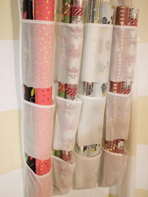 14 Ways to Organize Your Wrapping Paper and Gift Bags | HGTV Gift Bag Organization, Gift Bag Storage, Wrapping Paper Organization, Gift Wrap Organization, Craft Paper Storage, Wrapping Paper Storage, Gift Wrap Storage, Christmas Organization, Diy Wrap