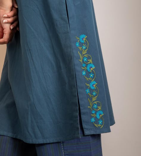 Haveli Crewel Blue Straight Fit Kurta - Handcrafted with delicate Kashmiri crewel floral embroidery, this kurta blends timeless artistry with contemporary design. Made from 100% pure cotton in a rich blue-green hue, it’s as comfortable as it is beautiful. With thoughtful details like flared sleeves, a stylized neckline, intricate embroidery, and practical side pockets, it’s perfect for every occasion – from festive gatherings to casual outings. #HaveliCollection #CrewelEmbroidery #handcra... Pocket Kurti Design Cotton, Simple Embroidery On Kurtis, Sleeve Embroidery Designs, Kashmiri Embroidery Suits, Hand Embroidery On Kurta, Hand Embroidered Kurtis, Pocket Embroidery Design, Blouse Sleeve Design, Thread Diy