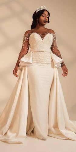 “This plus size weddnig gown is beaded with pearls. The long sleeve design has a peplum cut design. The detachable ball gown skirt adds a #fashion element. You can have this #bridal dress made as shown or with any changes. This can be made in #plussize for fuller figured #brides. Our custom #weddingdresses are affordable. We can work from our designs on our website. Or we can make custom #dresses based on #pictures you provide. Wedding Dresses South Africa, Wedding Dress Overskirt, Bridal Maxi Dress, Plus Size Wedding Gowns, Wedding Dress Guide, African Wedding Dress, Gaun Fashion, Dress Guide, Ball Gown Skirt