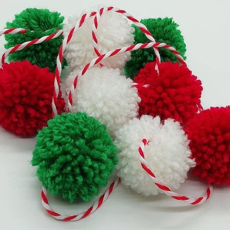 a pompom garland in traditional Christmas color and with a striped string will be a budget savvy and fun decoration Pom Pom Garland Christmas, Christmas Pompom, Pompom Garland, Pom Pom Decorations, Tassel Crafts, Christmas Decorations Garland, Pom Garland, Pom Pom Crafts, Garland Christmas