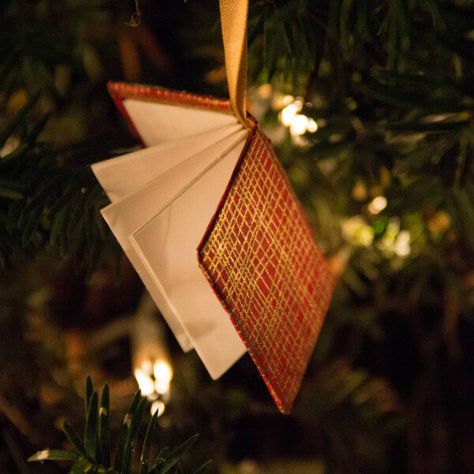 This red and gold miniature book on a satin ribbon is included in a round up of handmade paper tree ornaments Book Ornaments, Book Ornament, Book Christmas Tree, Music Ornaments, Paper Christmas Ornaments, Rustic Ornaments, Miniature Book, Vbs Crafts, Xmas Tree Decorations