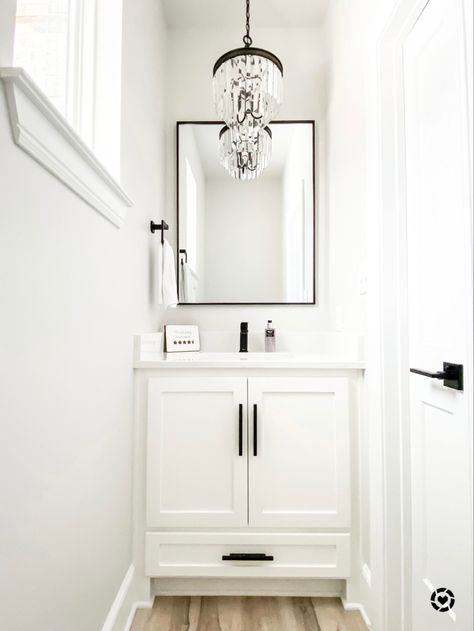 White and black powder room #chandelier #powderroomideas #guestbathroomideas #bathroomdecor #bathroomideas Clean Powder Room Ideas, White And Black Powder Room Ideas, Black White Gray Powder Room, Small Powder Room White Vanity, Powder Bathroom White Vanity, Half Bath With Chandelier, Guest Room Ideas Black And White, Small Powder Room Ideas Black And White, White Vanity Powder Room Ideas